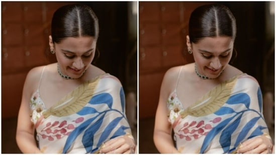 Taapsee accessorised her look with emerald ear studs, an emerald choker and silver rings from the shelves of House of Shikha and Anmol Jewellers.(Instagram/@taapsee)