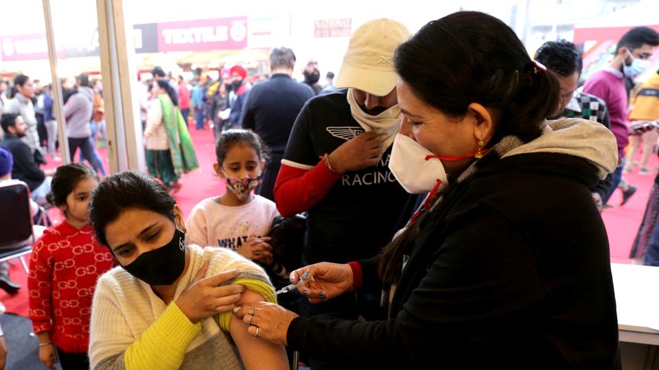A health care worker inoculates a beneficiary with a dose of the Covid-19 vaccine. (ANI) A health care worker inoculates a beneficiary with a dose of the Covid-19 vaccine. (ANI)