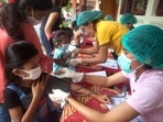 Students check their health before receive the Sinovac Covid-19 vaccine during a vaccination campaign at an elementary school in Bali, Indonesia&nbsp;