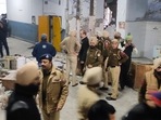 Police personnel inspect the blast site in Ludhiana on Thursday.