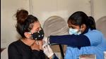 A health worker administers a dose of Covid-19 vaccine to beneficiary amid fear of spread of Omicron variant in Patna, on December 15. (PTI) A health worker administers a dose of Covid-19 vaccine to beneficiary amid fear of spread of Omicron variant in Patna, on December 15. (PTI)