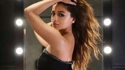 The body-hugging silhouette was completed with a pair of black heels and Alia left her wavy tresses open down her shoulders in side-parted hairstyle. (Instagram/hereforaliaabhatt)