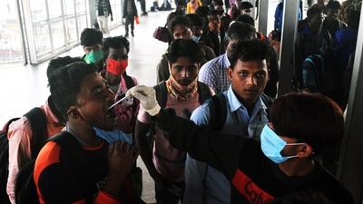 Modi said emerging clusters should be monitored closely and a good number of Covid-positive samples should be sent for genome sequencing. In picture - A healthcare worker collects a passenger's swab sample for Covid-19 test. (ANI) Modi said emerging clusters should be monitored closely and a good number of Covid-positive samples should be sent for genome sequencing. In picture - A healthcare worker collects a passenger's swab sample for Covid-19 test. (ANI)