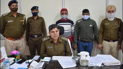 The two accused, who were arrested on the complaint of a Sector-20 resident, who lost ₹16.11 lakh to the gang. (Sant Arora/HT) The two accused, who were arrested on the complaint of a Sector-20 resident, who lost ₹16.11 lakh to the gang. (Sant Arora/HT)