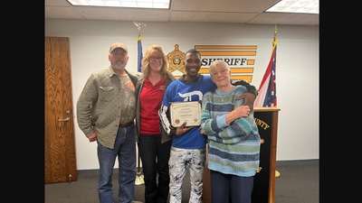 The image shows the man and the elderly woman along with others. (Facebook/@Butler County Sheriff's Office)