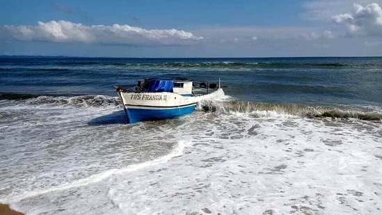 A photo made available by Madagascar's ministry of defense shows the wreck of the boat "Francia" after it was towed ashore near Mahambo, northeastern Madagascar, on Tuesday.&nbsp;(Madagascar defense ministry / Twitter)