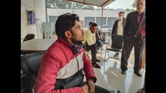 Congress claimed a BJP worker was caught by local residents in Sector 34, Chandigarh, while distributing over 150 fake voter IDs of local voters. (HT Photo)