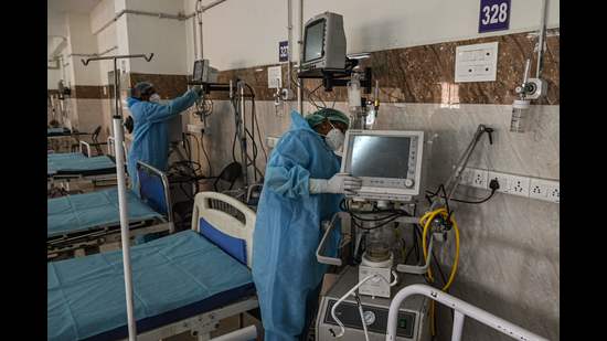 Medical staff preparing an isolation ward for Covid-19 coronavirus patients at a government hospital in Chennai on December 16, a day after the state reported its first case of Omicron variant of Covid-19. (AFP File Photo) Medical staff preparing an isolation ward for Covid-19 coronavirus patients at a government hospital in Chennai on December 16, a day after the state reported its first case of Omicron variant of Covid-19. (AFP File Photo)