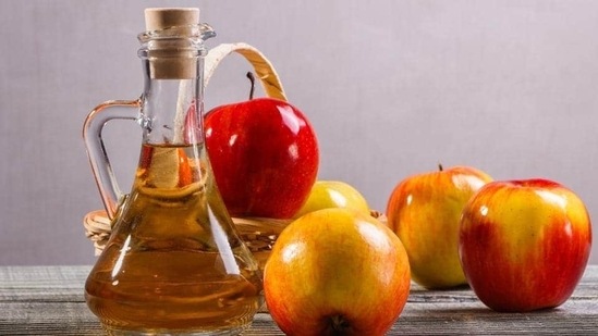 Apple cider vinegar - Add a tablespoon of apple cider vinegar to warm water and then place your feet inside the solution for around 15 minutes. This softens the skin of the ankles and also treats the cracked injuries.&nbsp;