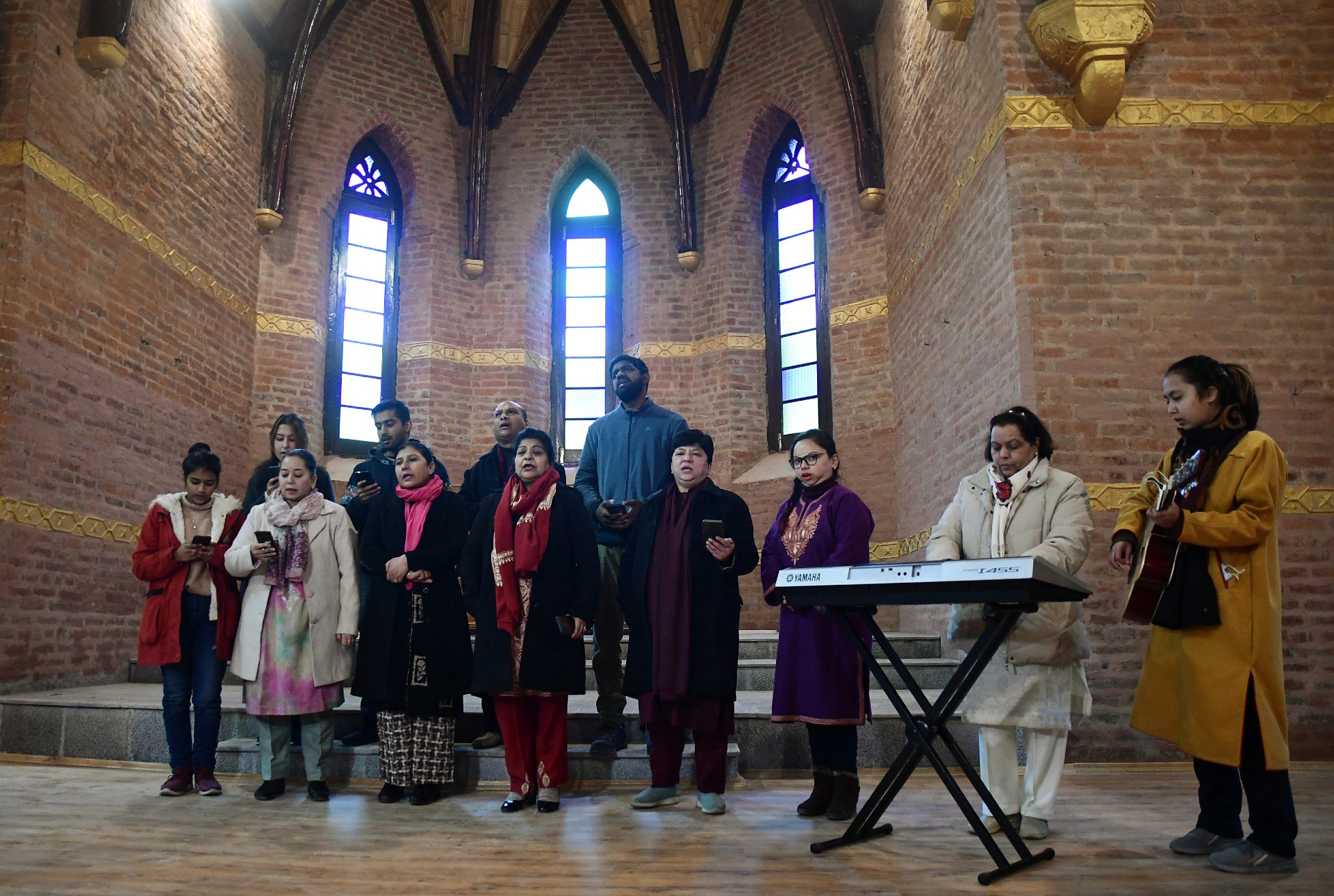 The Christian community holds prayers inside the Saint Lukes church. (PTI Photo)