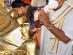 Sri Lankan Prime Minister Mahinda Rajapaksa with his wife Shiranthi offer worship at Lord Venkateswara Swamy temple at Tirumala in Tirupati (PTI Photo)(PTI)