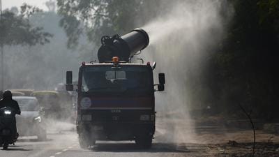 A truck mounted with an anti-smog gun is being used to spray water droplets to curb air pollution, at Kashmiri Gate in New Delhi. (Amal KS/ HT photo) A truck mounted with an anti-smog gun is being used to spray water droplets to curb air pollution, at Kashmiri Gate in New Delhi. (Amal KS/ HT photo)