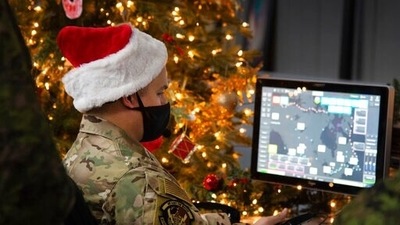 In this photo provided by the North American Aerospace Defense Command, a 22 Wing member is seen showing how they track Santa on his sleigh on Christmas evening during a media preview at the Canadian Forces Base in North Bay on Dec. 9, 2021. (AP) In this photo provided by the North American Aerospace Defense Command, a 22 Wing member is seen showing how they track Santa on his sleigh on Christmas evening during a media preview at the Canadian Forces Base in North Bay on Dec. 9, 2021. (AP)