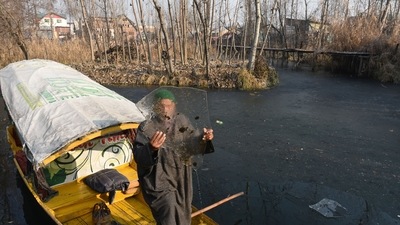 A boatman shows a piece of ice picked up from the partially frozen lake water in the interiors of Dal Lake in Srinagar, Jammu and Kashmir, (HT Photo/Waseem Andrabi) A boatman shows a piece of ice picked up from the partially frozen lake water in the interiors of Dal Lake in Srinagar, Jammu and Kashmir, (HT Photo/Waseem Andrabi)