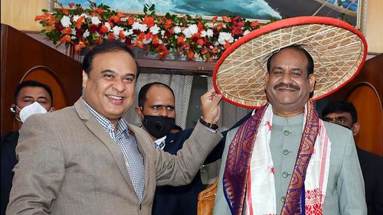 Lok Sabha speaker Om Birla being felicitated with traditional Assamese Japi (hat) and Gamocha by Assam chief minister Himanta Biswa Sarma at the official launch of the Assam Legislative Digital TV Assam Legislative Assembly in the central hall of the Assam Legislative Assembly in Guwahati.(ANI)