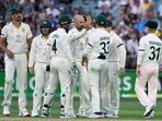 Australia's Nathan Lyon celebrates taking the wicket of England's Ollie Robinson with teammates