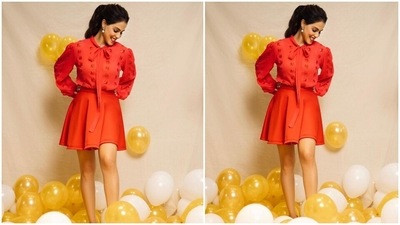 Genelia teamed the blouse with a matching bright red pleated skirt and accessorised the all-red look with pearl and stone-adorned drop earrings. Her centre-parted messy ponytail added a playful touch to the Christmas look. (Instagram/@geneliad) Genelia teamed the blouse with a matching bright red pleated skirt and accessorised the all-red look with pearl and stone-adorned drop earrings. Her centre-parted messy ponytail added a playful touch to the Christmas look. (Instagram/@geneliad)