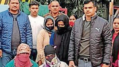 The suspects (faces covered) in police custody. (Sourced) The suspects (faces covered) in police custody. (Sourced)