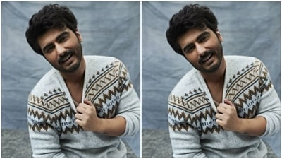 Arjun teamed a white sweater with maroon and black details near the chest and shoulders with a pair of dusky maroon trousers. (Instagram/@arjunkapoor)