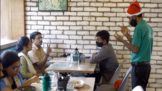 The menu in the pleasing Terrasinne restaurant is also well planned and unique, for each of the menu pages uses Indian sign language as a symbol along with each dish lined up with a unique symbol or sign and patrons are encouraged to use signs for the dish they want to order. (Rahul Raut/HT PHOTO)