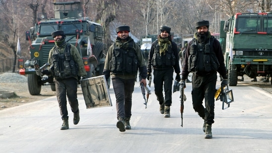 Security forces return after neutralising two terrorists at an encounter, in Shopian on Saturday.(ANI Photo)