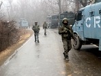 Security personnel patrol at the encounter site where the terrorist was killed by the security forces at the Arwani area in Anantnag.&nbsp;
