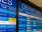 Cancelled flights on an electronic board at Washington Dulles International Airport in Dulles, Virginia, US, on Friday, Dec. 24, 2021. (Bloomberg) Cancelled flights on an electronic board at Washington Dulles International Airport in Dulles, Virginia, US, on Friday, Dec. 24, 2021. (Bloomberg)
