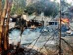 "People's Defence Forces" (PDF) have sprung up across the country to fight the junta, and have drawn the military into a bloody stalemate of clashes and reprisals. In picture - Smokes and flames billow from vehicles in Hpruso township, Kayah state, Myanmar.