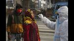 A health worker collects a swab sample from a woman to test for Covid-19, Jammu, December 28, 2020 (AP) A health worker collects a swab sample from a woman to test for Covid-19, Jammu, December 28, 2020 (AP)