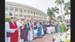 Suspended MPs read the Preamble outside Parliament to protest against their suspension. (PTI)