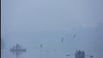 Visitors on a boat amid poor visibility due to dense fog, near Yamuna Bazaar, on Sunday. (Sanchit Khanna/HT)