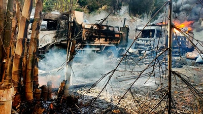 "People's Defence Forces" (PDF) have sprung up across the country to fight the junta, and have drawn the military into a bloody stalemate of clashes and reprisals. In picture - Smokes and flames billow from vehicles in Hpruso township, Kayah state, Myanmar. (AP) "People's Defence Forces" (PDF) have sprung up across the country to fight the junta, and have drawn the military into a bloody stalemate of clashes and reprisals. In picture - Smokes and flames billow from vehicles in Hpruso township, Kayah state, Myanmar. (AP)