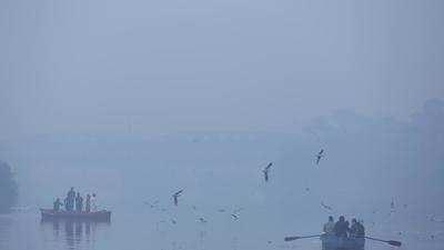 Visitors on a boat amid poor visibility due to dense fog, near Yamuna Bazaar, on Sunday. (Sanchit Khanna/HT) Visitors on a boat amid poor visibility due to dense fog, near Yamuna Bazaar, on Sunday. (Sanchit Khanna/HT)