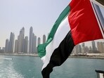 UAE flag flies over a boat at Dubai Marina, Dubai, United Arab Emirates. (REUTERS)