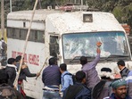 Visuals of the violence that went viral on social media showed a large group of people surrounding the police vehicles, climbing on top of them, pelting them with stones and then thrashing them with sticks, leaving the vehicles in shambles.(PTI) Visuals of the violence that went viral on social media showed a large group of people surrounding the police vehicles, climbing on top of them, pelting them with stones and then thrashing them with sticks, leaving the vehicles in shambles.(PTI)