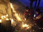 A Naga man takes a photograph of another lighting a candle in memory of 14 civilians killed by Indian army soldiers earlier this month in Nagaland. A Naga man takes a photograph of another lighting a candle in memory of 14 civilians killed by Indian army soldiers earlier this month in Nagaland.