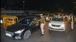 Delhi police personnel check vehicles during night curfew, at Connaught Place in New Delhi on Monday. (ANI) Delhi police personnel check vehicles during night curfew, at Connaught Place in New Delhi on Monday. (ANI)