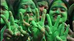 Supporters of the Trinamool Congress (TMC) celebrate the party's victory in the Kolkata Municipal Corporation (KMC) elections, near the residence of the West Bengal chief minister and TMC leader Mamata Banerjee, in Kolkata on December 21, 2021. (AFP) Supporters of the Trinamool Congress (TMC) celebrate the party's victory in the Kolkata Municipal Corporation (KMC) elections, near the residence of the West Bengal chief minister and TMC leader Mamata Banerjee, in Kolkata on December 21, 2021. (AFP)