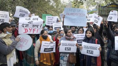 Members of All India Students' Association (AISA), Students' Federation of India (SFI) and other organisations protest against the hate speech during a recent religious gathering in Haridwar, on Monday. (PTI)