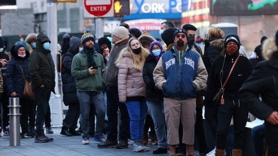 People queue for a Covid-19 test in Times Square as the Omicron coronavirus variant continues to spread in Manhattan, New York City. (REUTERS)