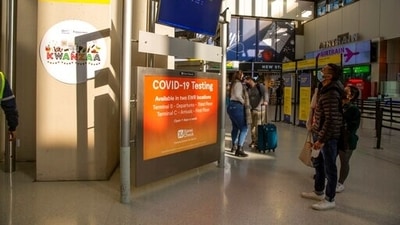 People with symptoms during isolation, or who develop symptoms during quarantine, are encouraged to stay home. In picture - Holiday travelers enter Newark Liberty International Airport. (AP) People with symptoms during isolation, or who develop symptoms during quarantine, are encouraged to stay home. In picture - Holiday travelers enter Newark Liberty International Airport. (AP)