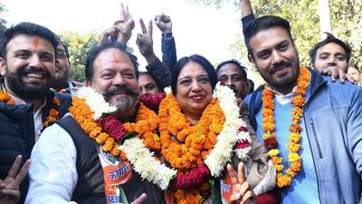 Congress candidate Harpreet Babla, her husband Davinder Singh Babla along with supports celebrate after winning the MC poll in Chandigarh on Monday. (Keshav Singh/ HT)