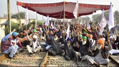 Farmers blocking a railway track during a protest against the Punjab government at Devi Dass Pura village in Amritsar on December 20. Farmers blocking a railway track during a protest against the Punjab government at Devi Dass Pura village in Amritsar on December 20.