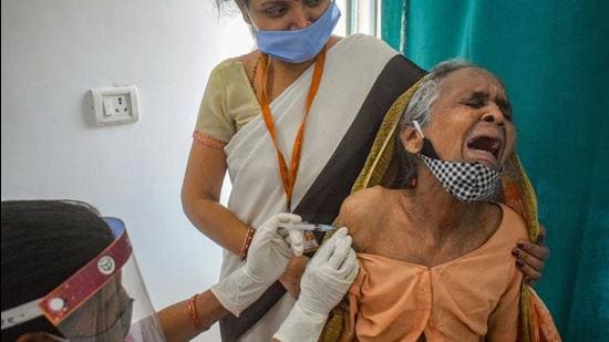 An elderly person being administered the Covid-19 vaccine at a hospital in Prayagraj on March 6, days after India decided to administer a third dose, being called the precaution dose, to healthcare workers, frontline workers and people aged 60 and above with comorbidities. (PTI)