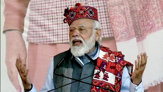 Prime Minister Narendra Modi addresses at the inauguration and stone laying foundation ceremony of hydropower projects in Mandi on Monday. (ANI)