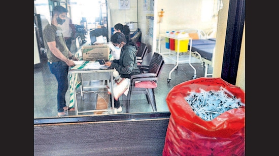 A beneficiary registers at the Kamla Nehru hospital to be vaccinated. (Shankar Narayan/HT PHOTO)