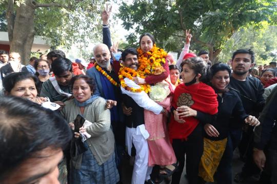Taruna Mehta of the Aam Aadmi Party celebrating her victory in the municipal corporation elections in Chandigarh on Monday. (Keshav Singh/HT)