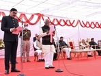 Haryana Governor Bandaru Dattatreya administers oath to Devender Singh Babli as Cabinet minister during swearing-in ceremony.(ANI) Haryana Governor Bandaru Dattatreya administers oath to Devender Singh Babli as Cabinet minister during swearing-in ceremony.(ANI)