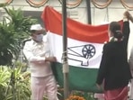 Congress president Sonia Gandhi unfurls the flag at AICC headquarters on Tuesday.