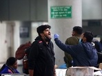 A healthcare worker collects a swab sample of a passenger at Kashmere Gate ISBT amid a surge in Omicron cases, in Delhi on Tuesday. A healthcare worker collects a swab sample of a passenger at Kashmere Gate ISBT amid a surge in Omicron cases, in Delhi on Tuesday.
